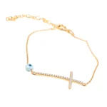 PULSEIRA COM CRUZ EM PRATA DOURADA COM OLHO TURCO E ZIRCÓNIAS
